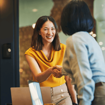 DOC_KC_PNG_Stock_onboarding woman shaking hand with woman welcoming to team