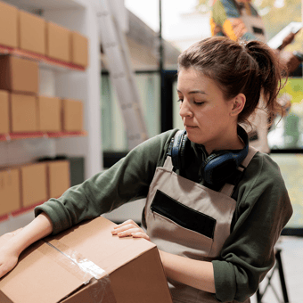 DOC_KC_PNG_Stock_wholesale and distribution women holding box in warehouse